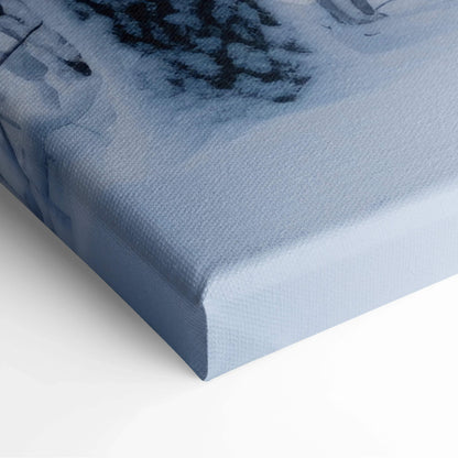 Close-up of canvas wall art featuring a winter forest scene with snowy trees in soft blue tones.