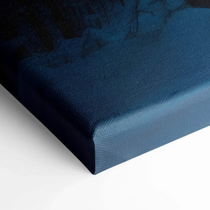 Close-up of blue canvas wall art corner with textured fabric and subtle forest silhouette detail.
