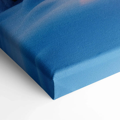 Close-up of blue canvas texture stretched over a thick wooden frame, showcasing high-resolution print quality for wall art.