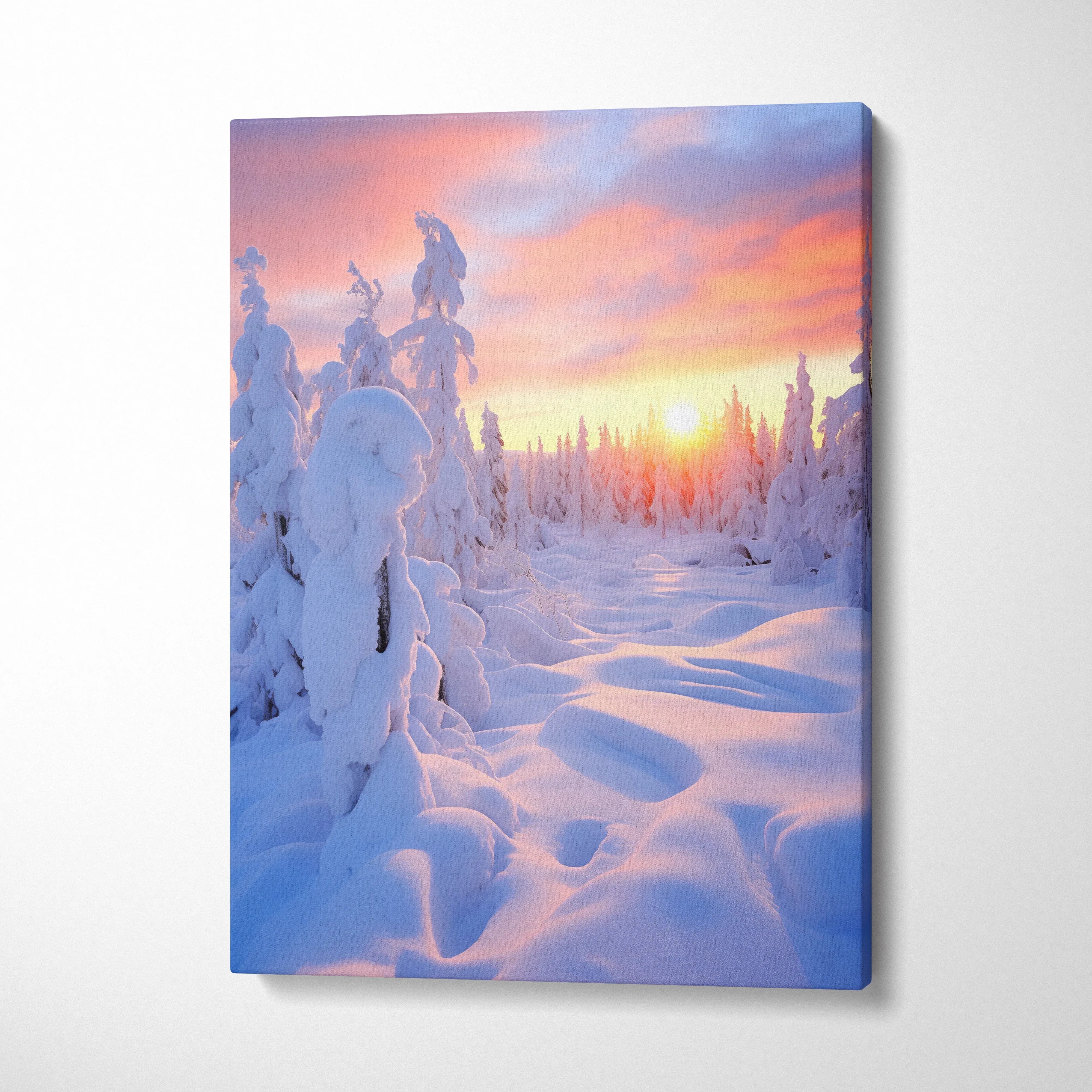 Canvas wall art featuring a snowy winter landscape at sunset with soft pink and orange skies for home decor.