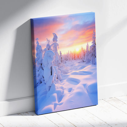 Canvas wall art featuring a snowy forest at sunset with vibrant pink and orange sky hues and detailed snow-covered trees.