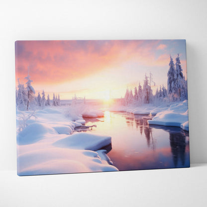 Canvas wall art of a snowy winter landscape with a glowing sunset and a calm river winding through snow-covered trees.
