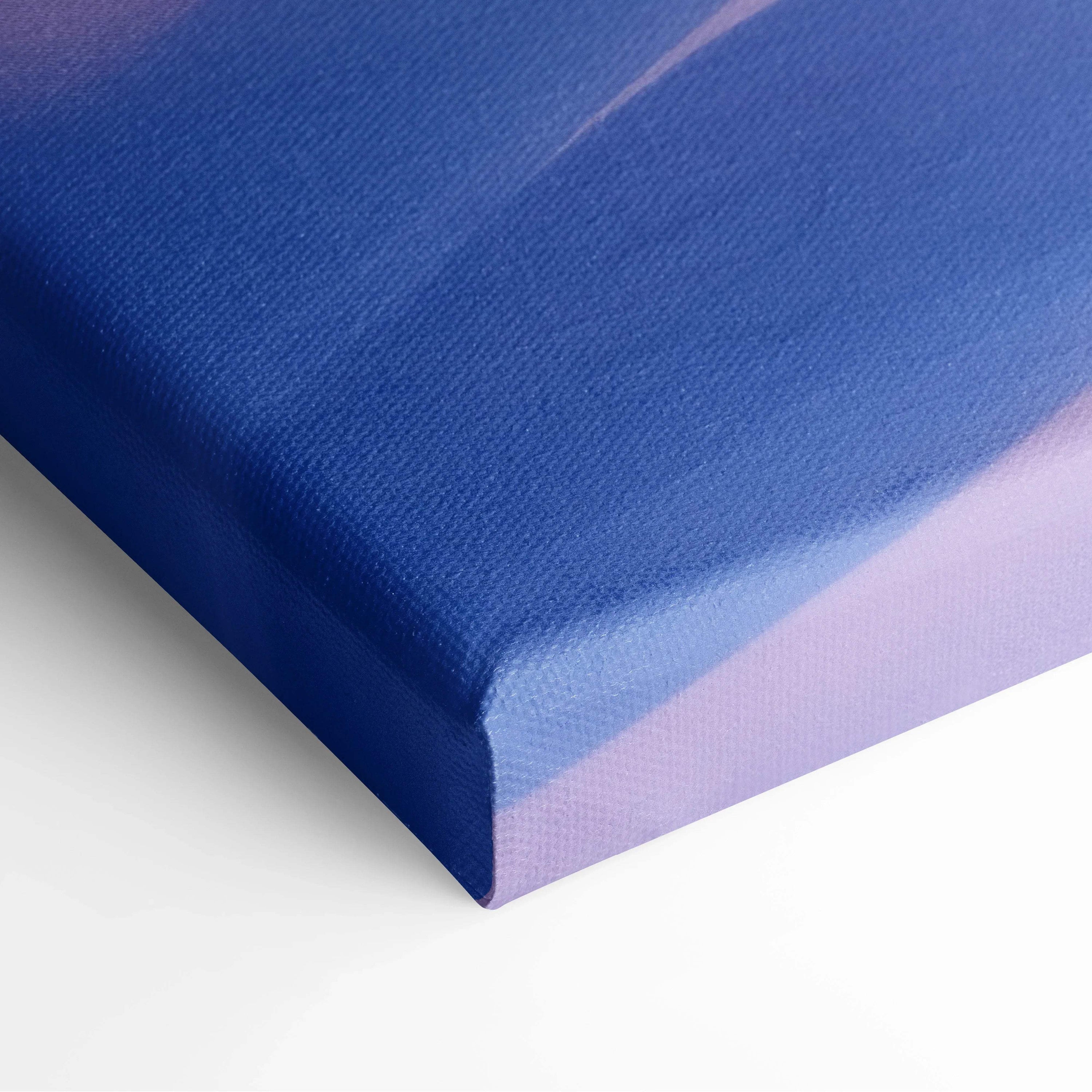 Close-up of canvas wall art corner showing textured fabric in soft blue and lavender tones for decorative use.