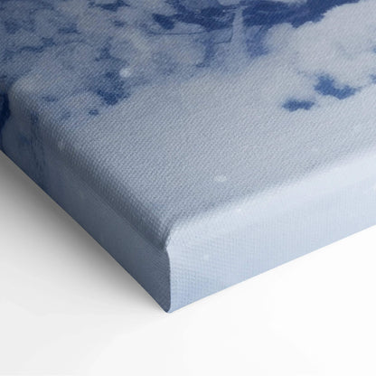 Close-up of thick canvas wall art corner with soft blue and white snowy winter digital print texture.