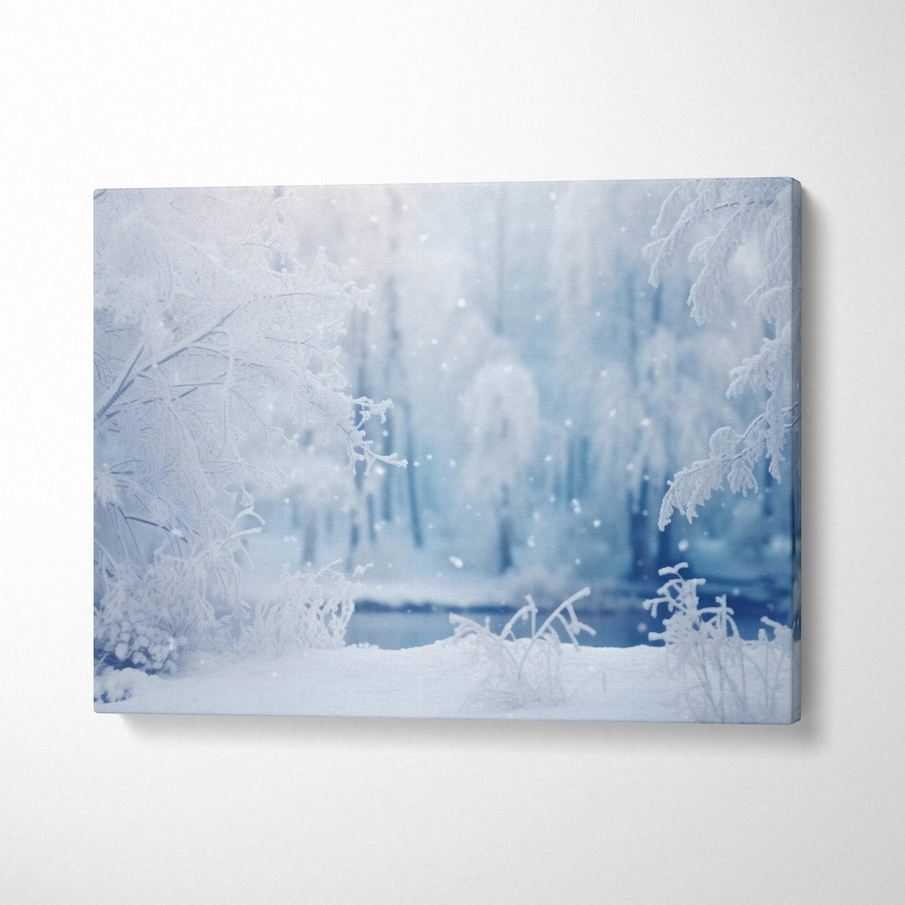 Winter snowy forest scene canvas wall art with delicate icy branches in soft blue tones for home decor.