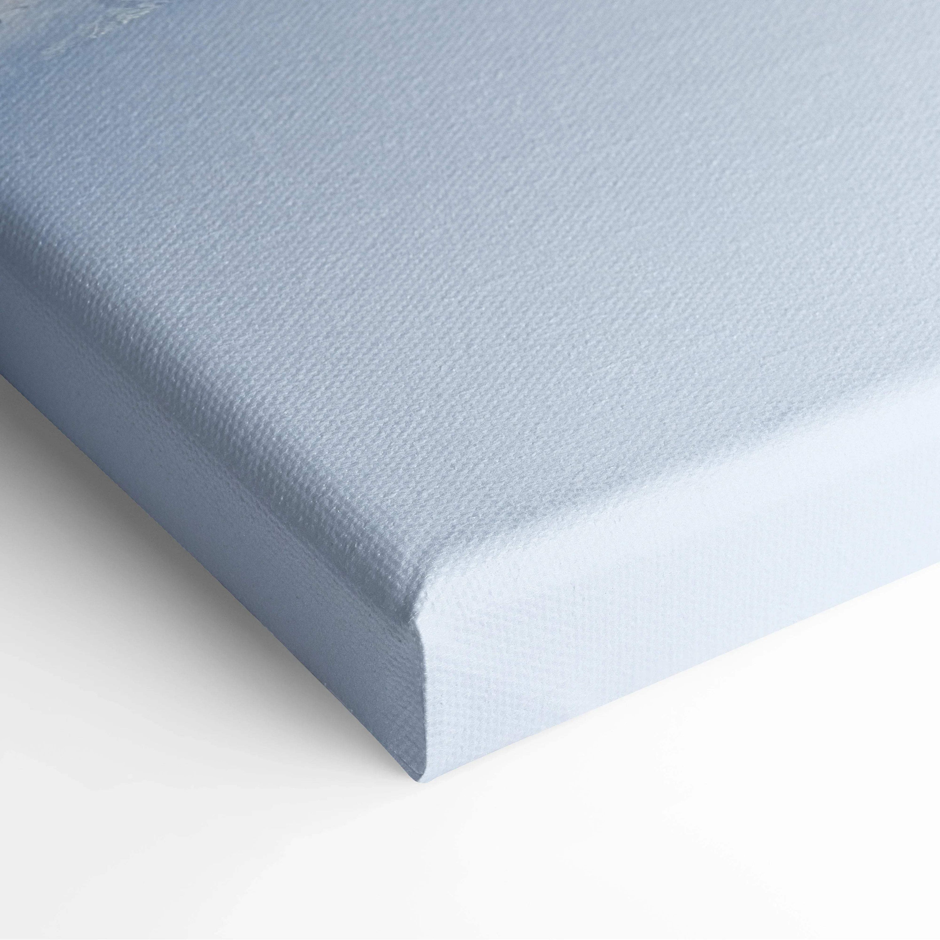 Close-up of stretched white canvas with subtle fabric texture, ready for digital art display.