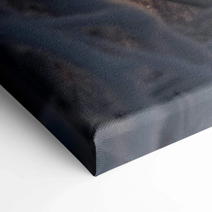 Close-up of canvas wall art corner with textured dark winter forest and snowy landscape at sunset colors.