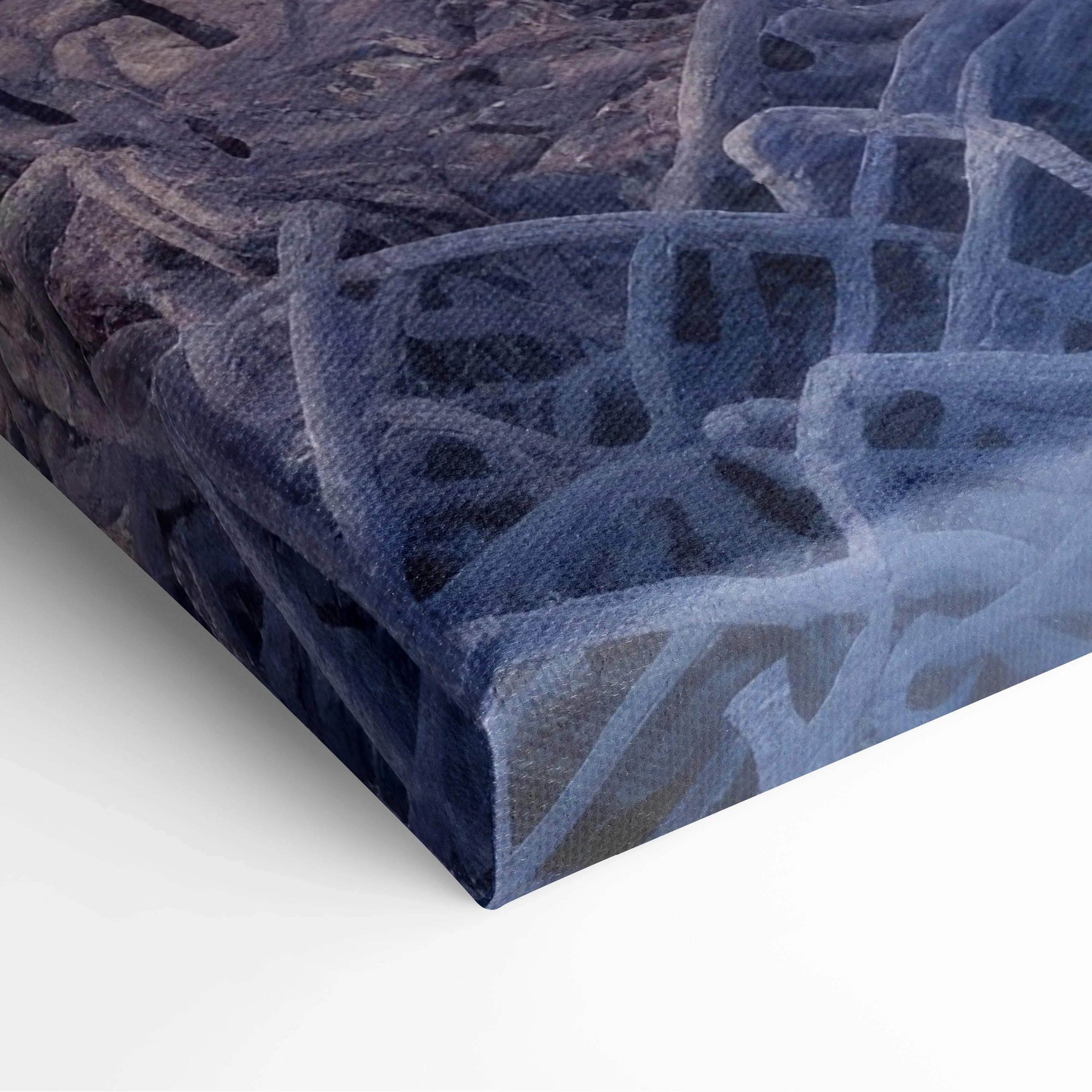 Close-up of stretched canvas print featuring abstract deep blue and purple digital art with textured surface and sharp edges.