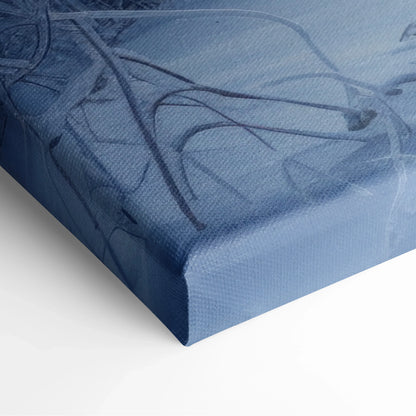 Close-up of a canvas wall art corner with textured fabric surface and abstract blue and gray lines design.