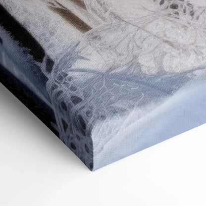 Close-up of canvas wall art corner featuring soft blue and white winter snowy landscape with subtle tree silhouettes and.