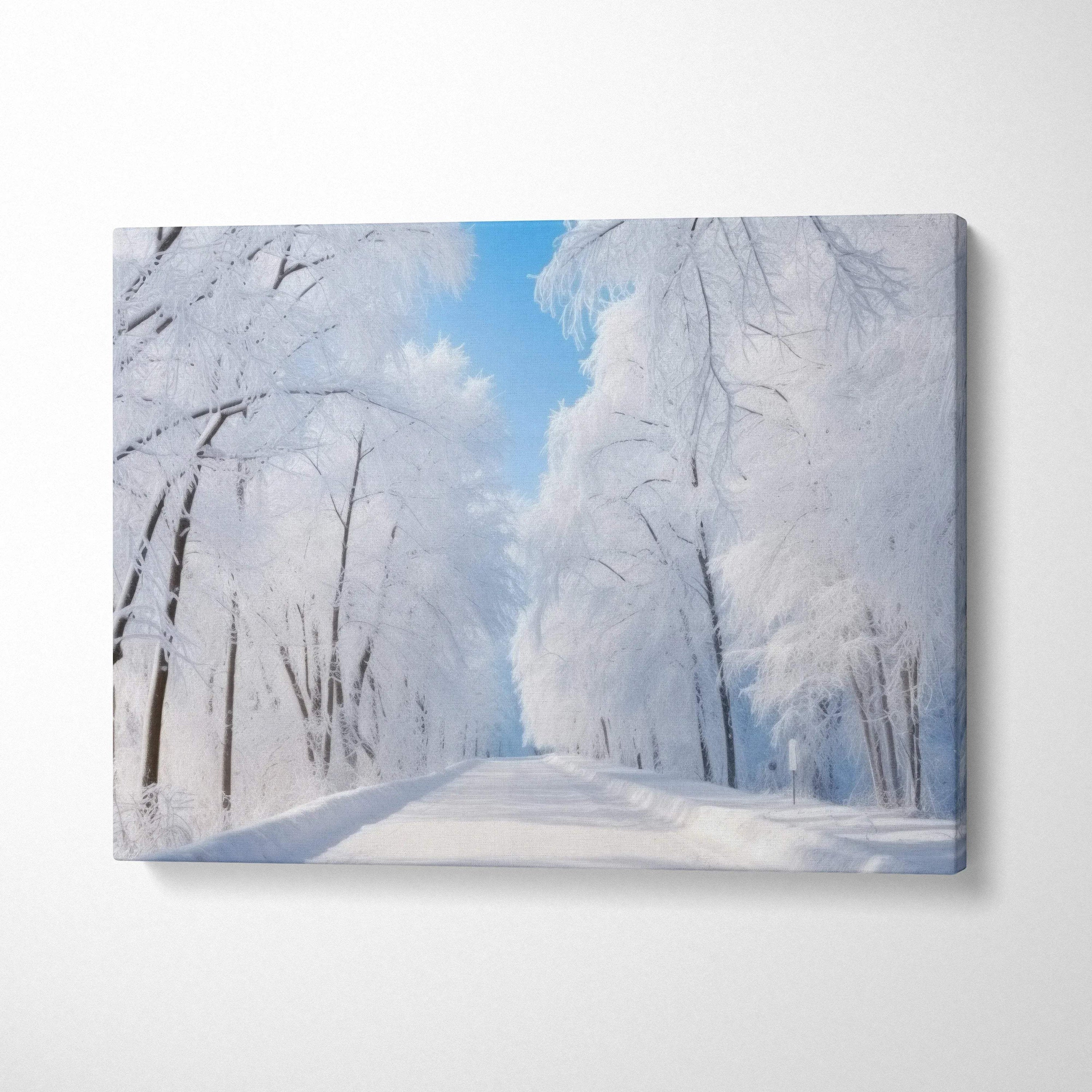 Winter landscape canvas wall art featuring dreamy snowy trees and a clear blue sky decor.