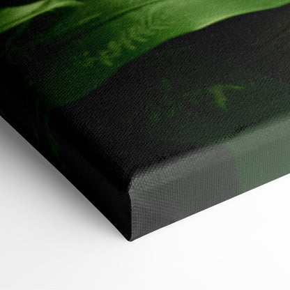 Close-up of canvas wall art corner with dark green and black nature landscape design.