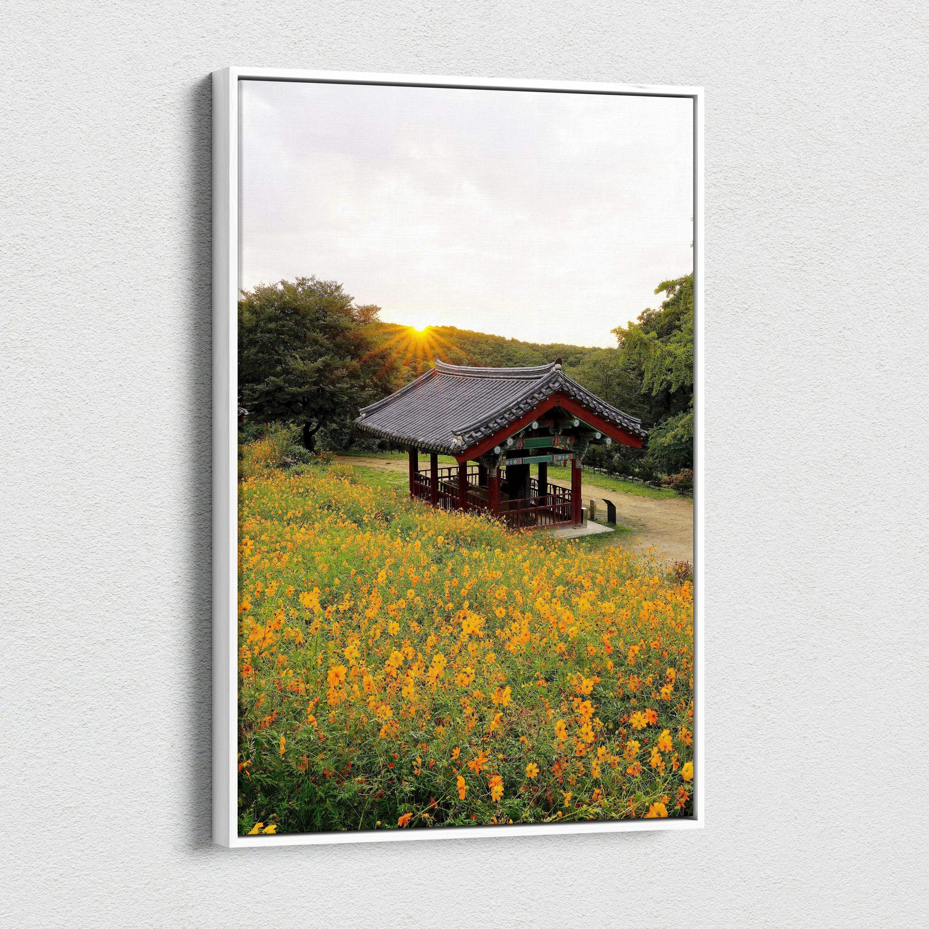 Canvas wall art featuring vibrant yellow flowers with a traditional Asian pavilion at sunset.