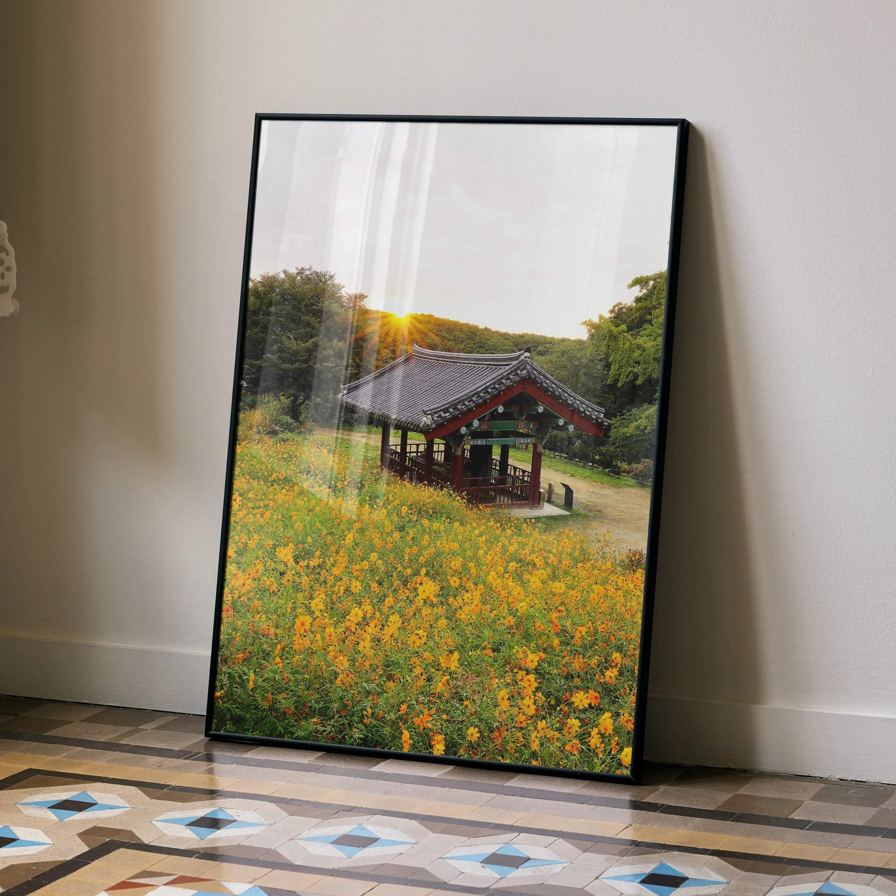 Serene sunset floral field with traditional building poster wall art in vertical format.