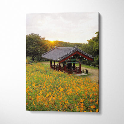 Canvas wall art featuring vibrant yellow flowers and traditional Asian architectural pavilion at sunset.